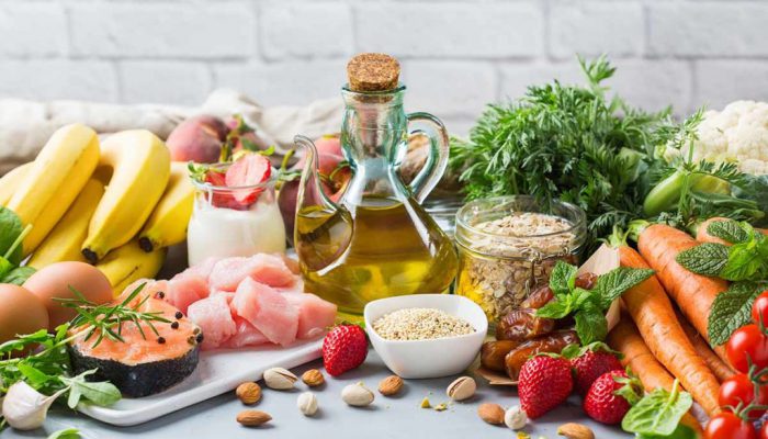 Balanced nutrition concept for DASH clean eating flexitarian mediterranean diet to stop hypertension and low blood pressure. Assortment of healthy food ingredients for cooking on a kitchen table.